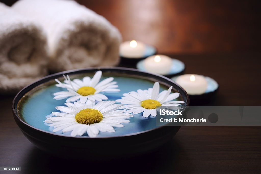 Spa Treatment Tranquil scene with candle and daisy flower. XXXL image Alternative Therapy Stock Photo