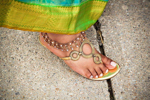 Gold ankle chain stock photo