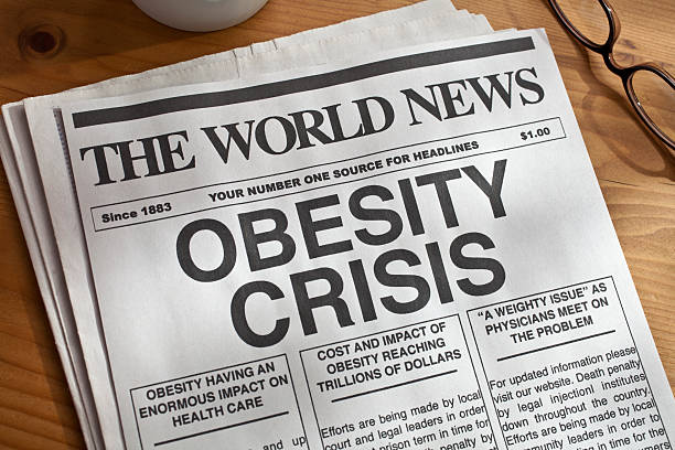 istock Mock newspaper with big headline on obesity crisis 184275674