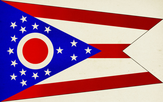 State of Ohio paper flag close up with light effect and vignette. Visible paper texture for super realistic effect. Selective focus. Canon 5D Mark II and Sigma lens.SEE MORE US STATE FLAGS BELOW: