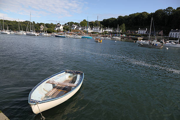 istock dinghy moored belon river as evening tide comes in marina 184276611