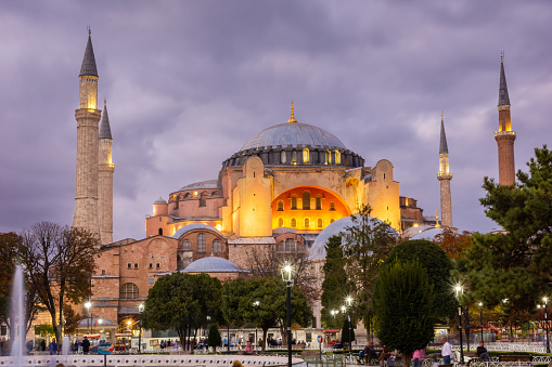 Istanbul, Turkey, 16 October 2023: Dramatic cloudy sky at twilight over Hagia Sophia mosque and Sultanahmet Square