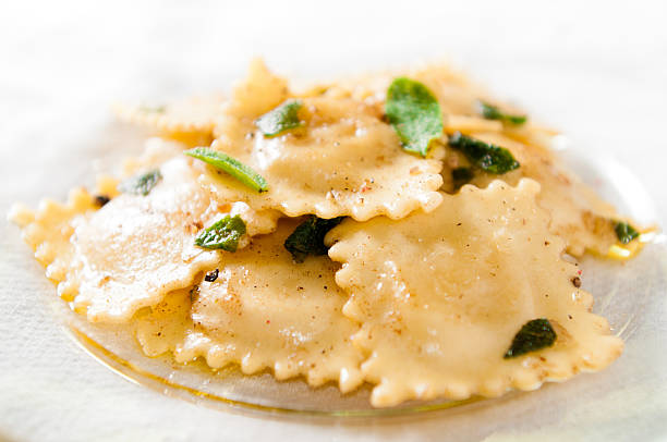 Cheese Ravioli in Brown Butter Sage Sauce stock photo