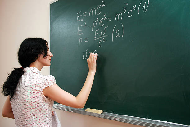 istock Girl writing formula at the desk 184277679