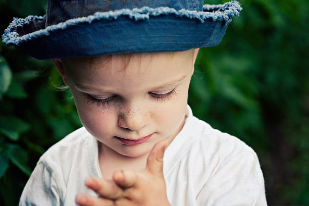 istock Cute little boy watching his messy hands 184278547