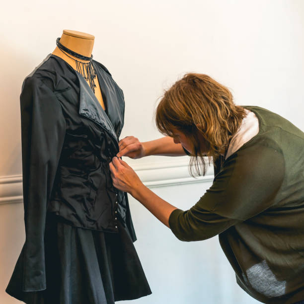 istock Fashion designer dressing a mannequin with black clothes 1842788848