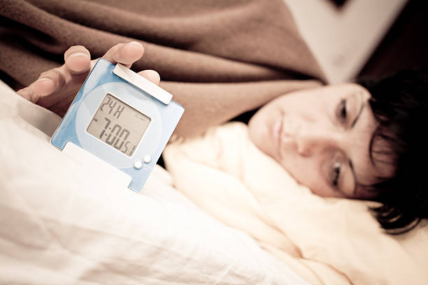 istock Young Woman Waking Up at Early Morning 184279216