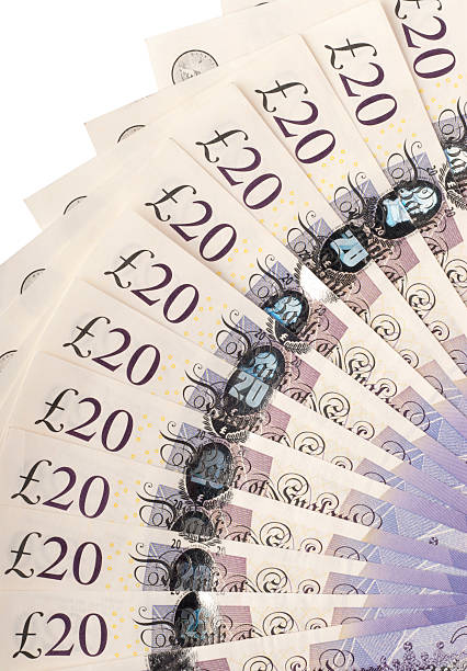 istock Twenty pound notes fanned out on white 184279479