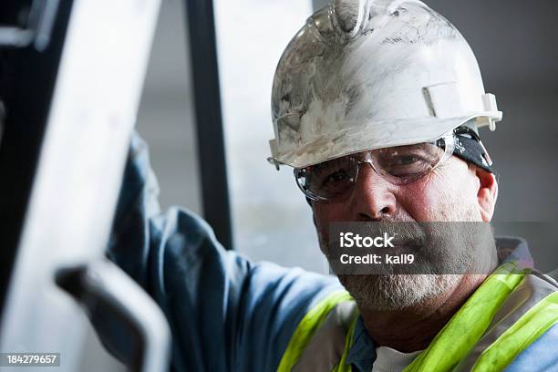 Manual Worker In Hard Hat And Safety Glasses Stock Photo - Download Image Now - Construction Worker, Portrait, Manufacturing Occupation