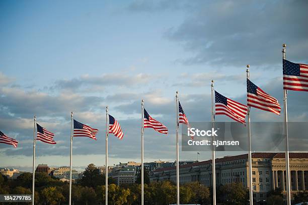 American Flag Near The Washington Monument At Sunrise Stock Photo - Download Image Now