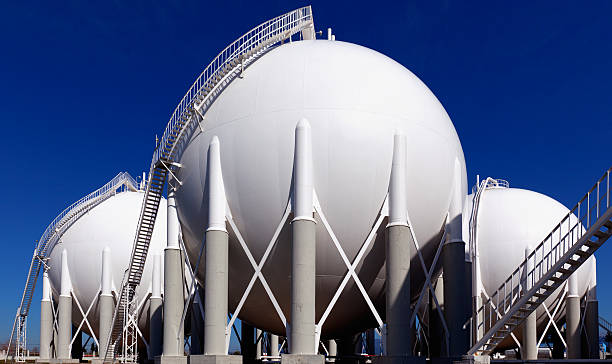 Three round holding tanks at petrochemical plant stock photo