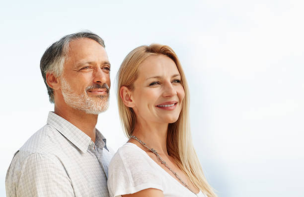 istock Happy couple looking away 184280116