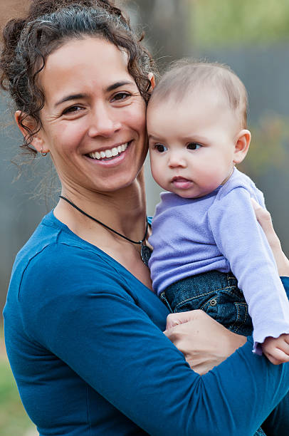 istock Smiling mom and baby 184280400