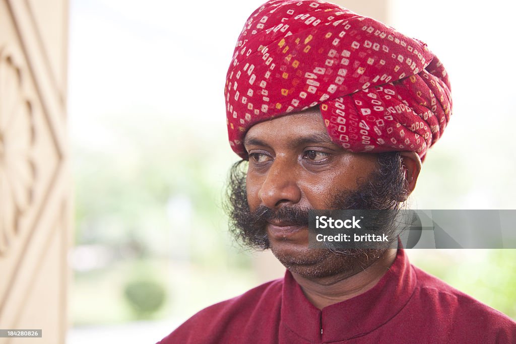 Indian man with impressive sideburns and red turban. Indian man with impressive sideburns and red turban.'See also my LB: Adult Stock Photo