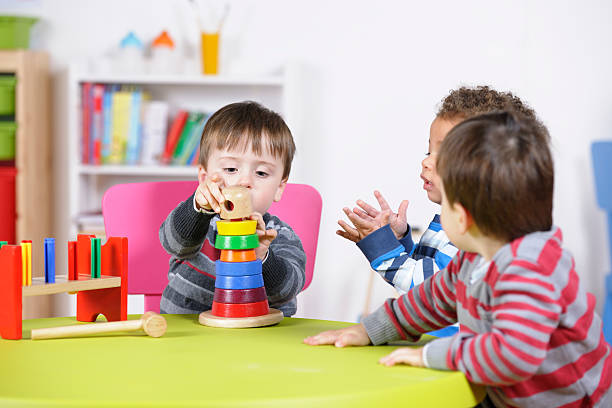istock Group Of Toddlers Playing With Developmental Toys 184281325