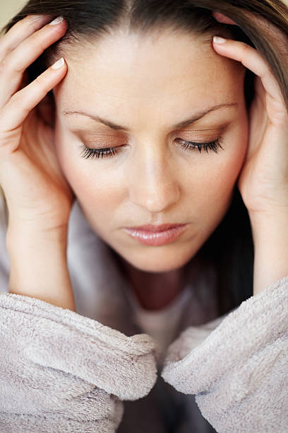 istock Woman with severe headache 184281491