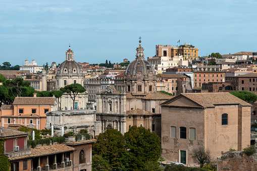 Landscaped rooftops of Rome, Italy, Europe. Rome skyline with old residential houses. Landscaping of terraces, mansard and roofs with plants in Roma city. Nice cityscape and aerial view of Rome.