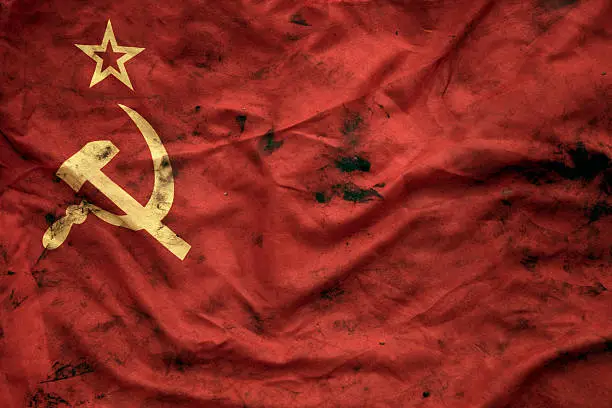 Low key photography of grungy old Soviet Union flag. USSR, CCCP.