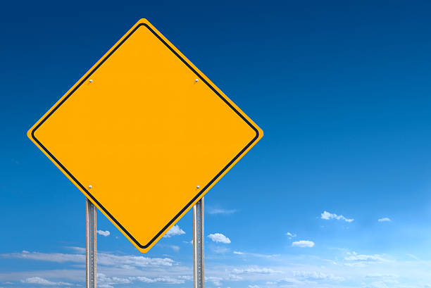 istock Blank Road Warning Direction Sign Post over Blue Sky Background 184281691