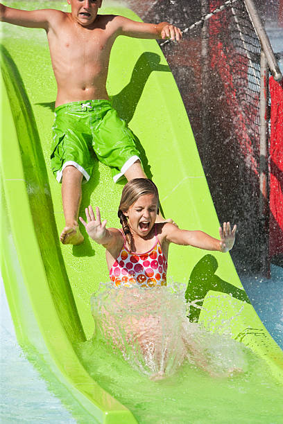 istock Kids on slide at water park 184281830