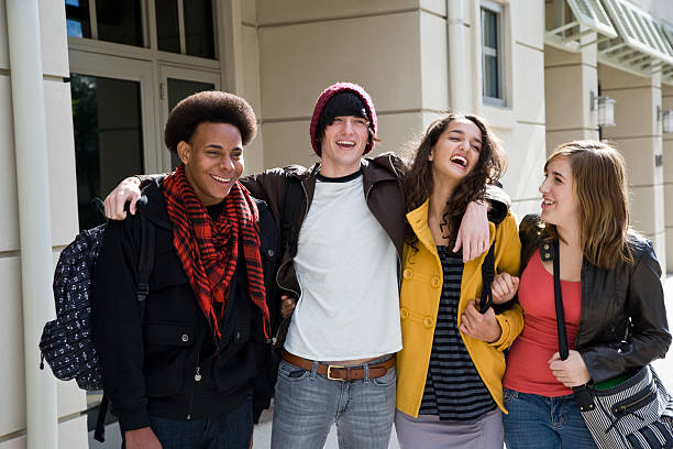 istock University students on campus carrying bookbags 184282036