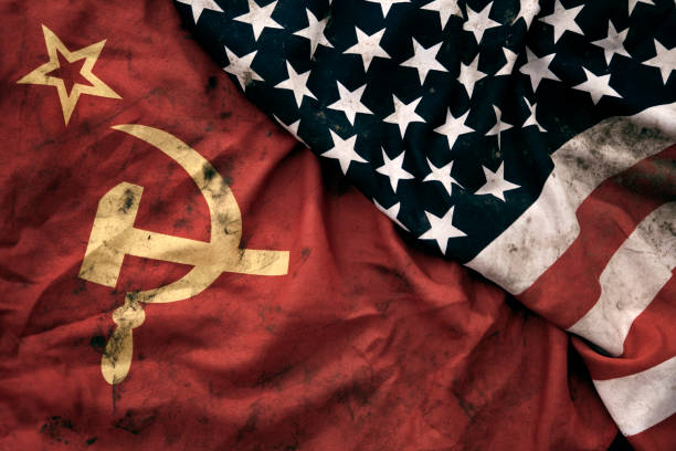 Grungy Flags of Soviet Union and USA Low key photography of grungy old Soviet Union and United States of America flags. USSR, CCCP, USA. russian flag stock pictures, royalty-free photos & images