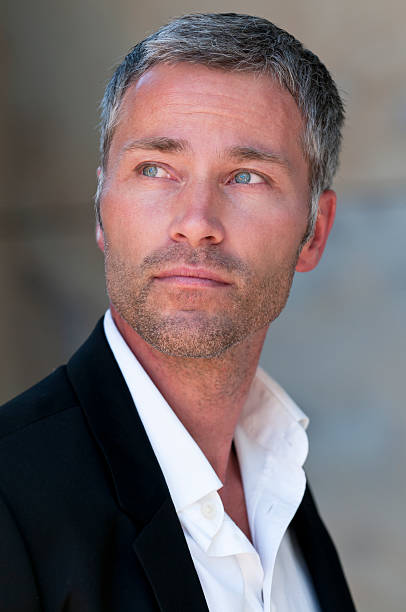 pensive businessman with grey hair