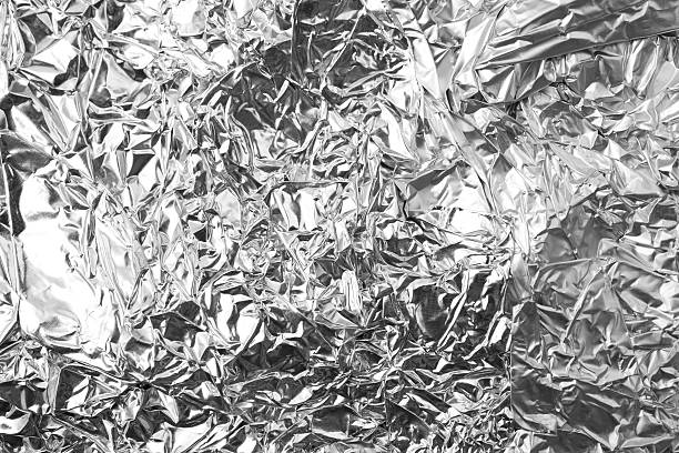 aluminium tinfoil background. aluminum stock pictures, royalty-free photos & images