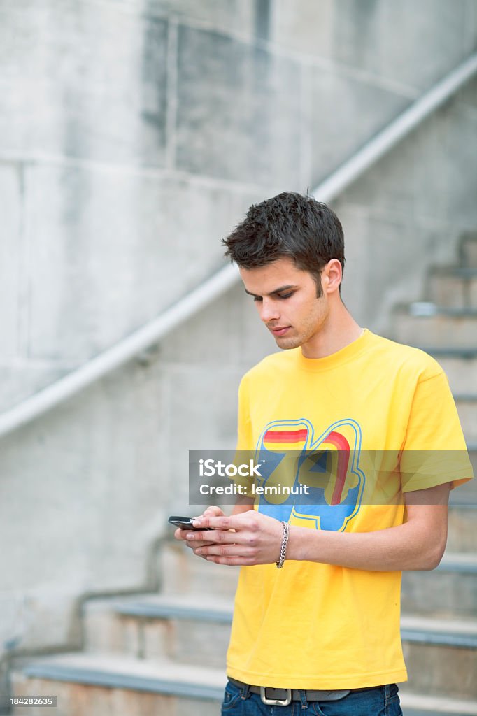 Teenager with mobile phone Teenager talking with a mobile phone. Image created during WPO / London ISTOCKALYPSE 2011 event.  16-17 Years Stock Photo