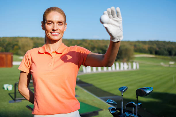 istock Youthful Golfer Holding Golf Ball 1842829088
