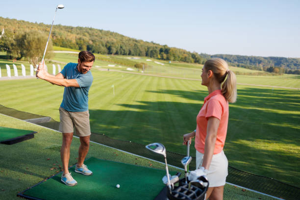 istock Active Couple Perfecting Golf Strokes Outdoors 1842829845