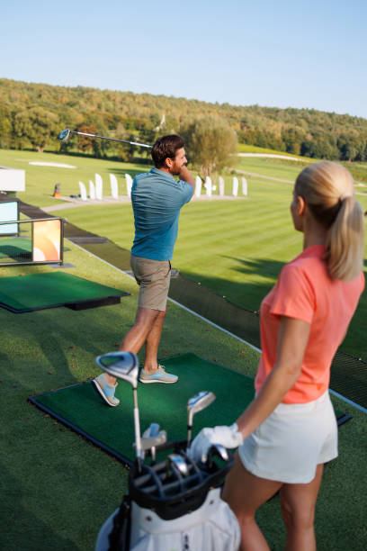 istock Driven Couple Perfecting Golf Skills 1842830374