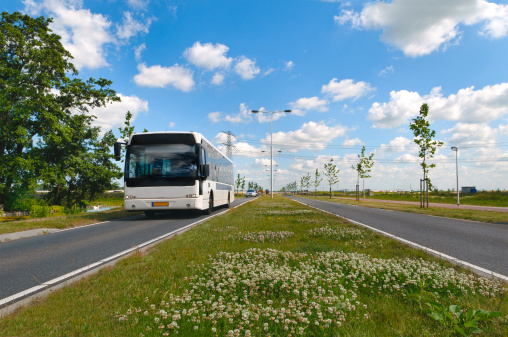 Approaching bus on a new dutch road on a nice spring day.Similar image: