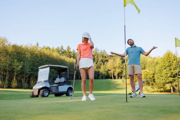 istock Disheartened Couple at Golf's Last Stretch 1842841451