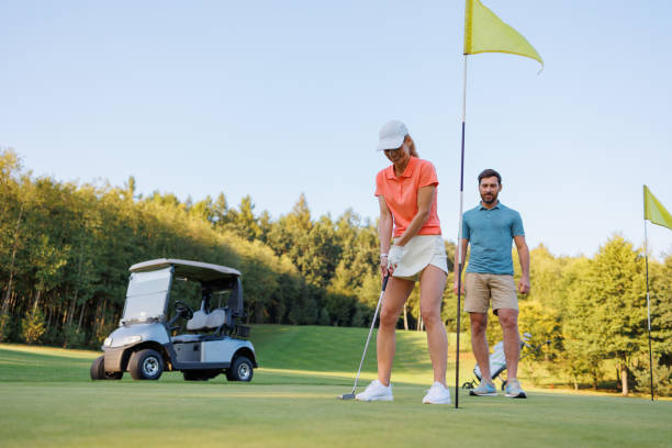 istock Intense Moment: Woman Concentrating on Golf Swing 1842841453