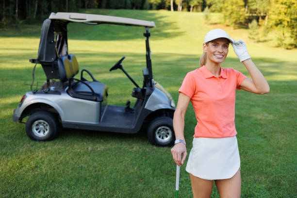 istock Young Golfer on Course with Cart in View 1842841973