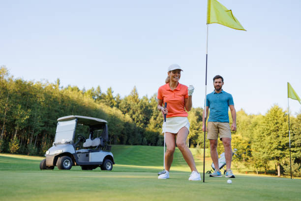 istock Celebrating Victory: Couple at Golf's Last Hole 1842841985