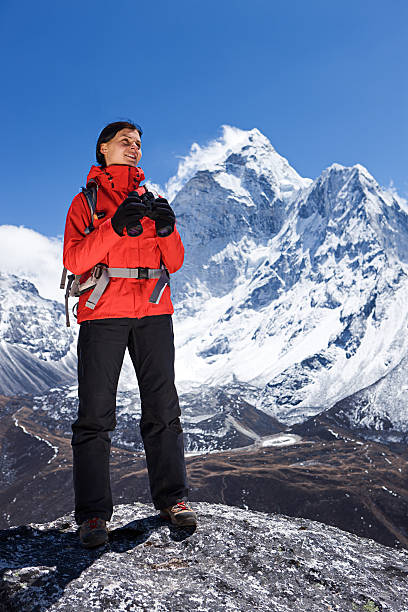 istock Woman is looking through binoculars in Mount Everest National Park 184284328