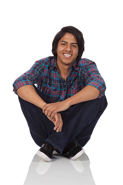istock Man sitting on floor and smiling 184284423