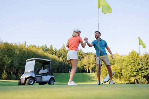 istock Triumphant Couple Conquers Last Golf Hole 1842844640