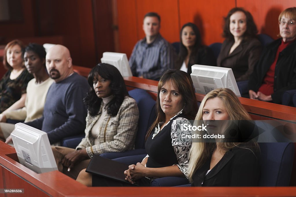 Diverse Group of Jurors A diverse group of people in the jury box of a courtroom. Juror - Law Stock Photo