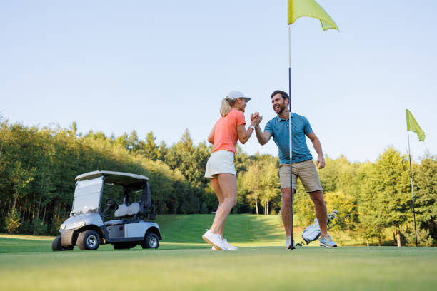 istock Victorious Woman Celebrates Golf Win with Partner 1842845090