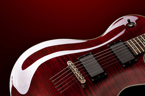 Guitar on red background. stock photo