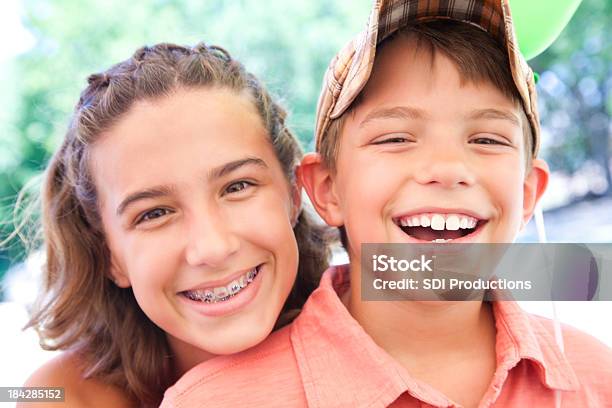 Close Brother And Sister Having Fun Together Stock Photo - Download Image Now - Dental Braces, Boys, Child