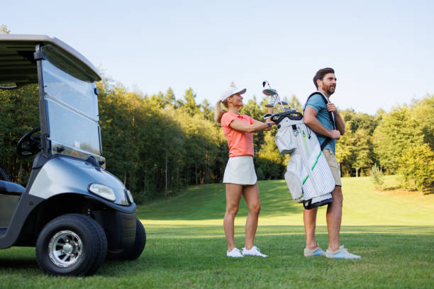 istock Golf Affection: Woman Choosing Club from Partner's Bag 1842853598