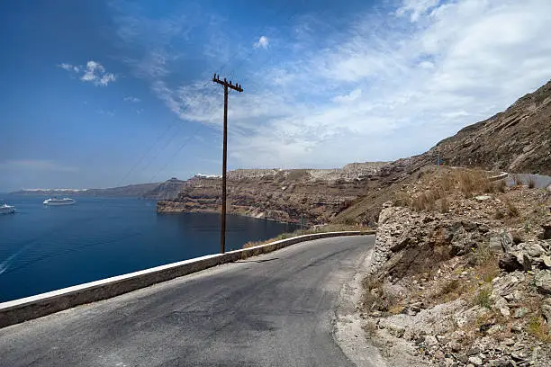 "Road on the Greek island of Santorini, cruiseship in bay"