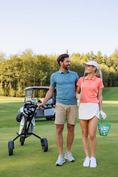 istock Stylish Couple Golfing with Scenic Background 1842855203