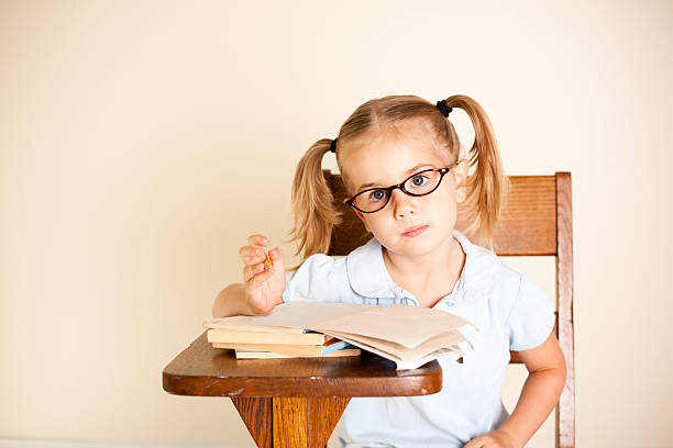 istock Young Kindergardener Sitting at Desk 184285587