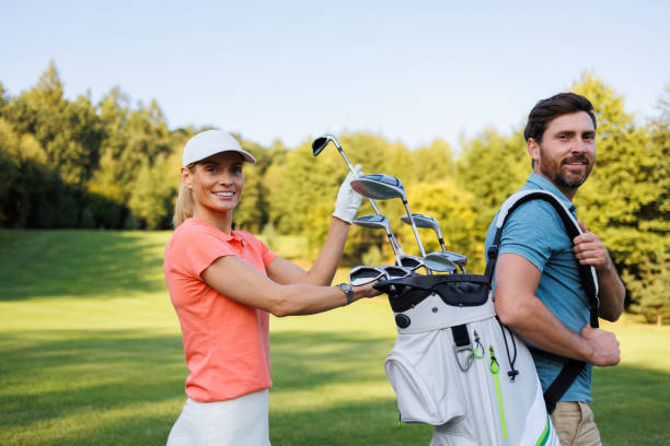 istock Partner Interaction: Woman Selects Club from Golf Bag 1842858912