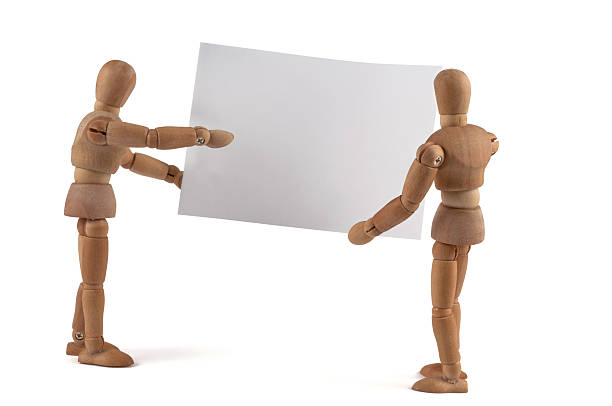 istock Wooden Mannequin holding blank sign 184286008